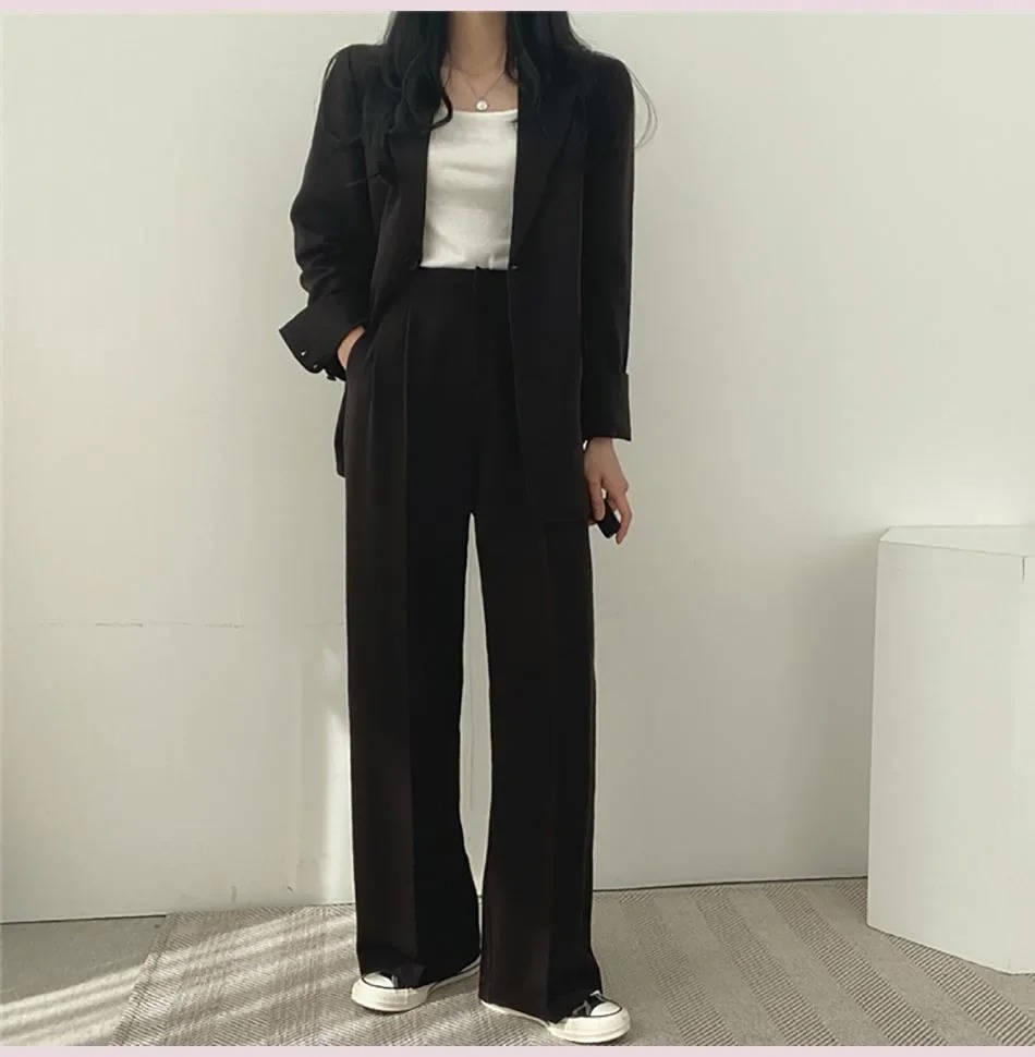 Women's casual two-piece blazer and wide-leg pants suit set in coordinated solid color