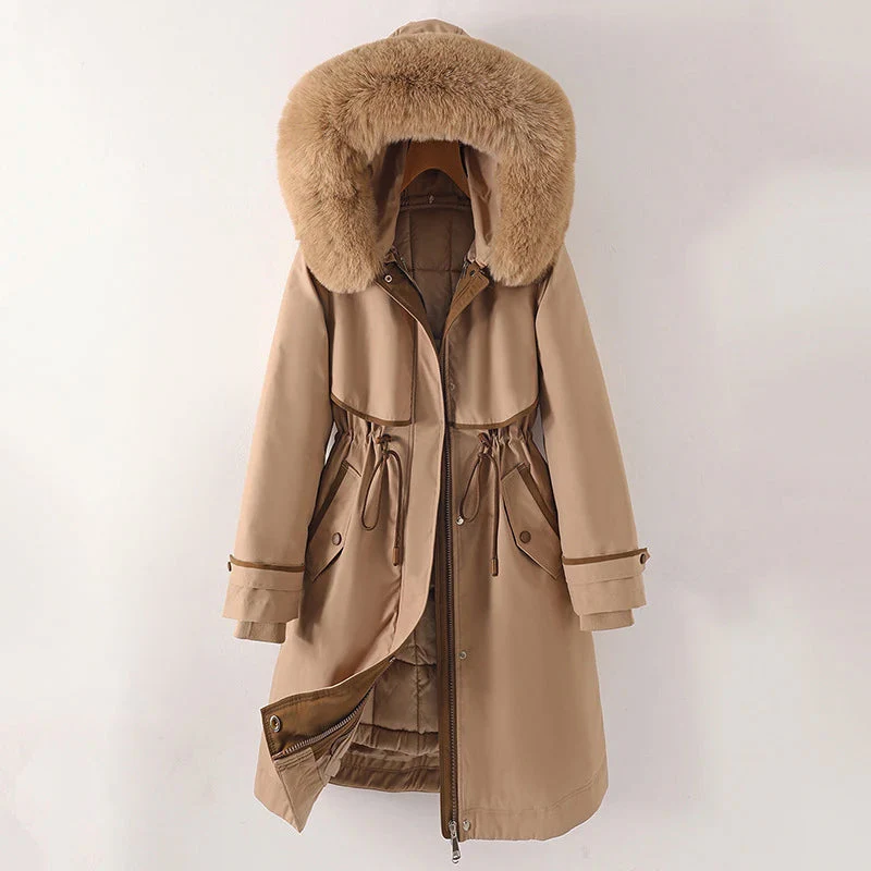 Women's tailored parka jacket with fur trim hood and quilted lining for a polished winter look