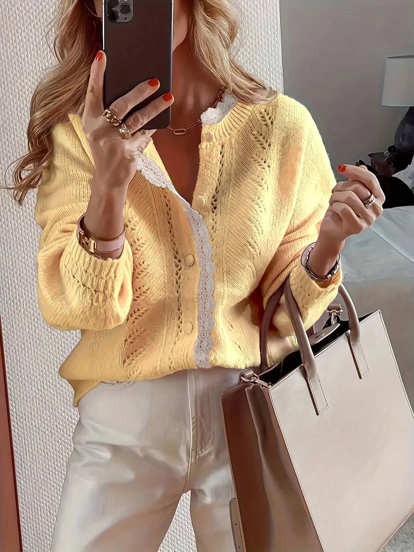 Long sleeve knitted cardigan sweater with delicate lace trim detail, relaxed open-front style