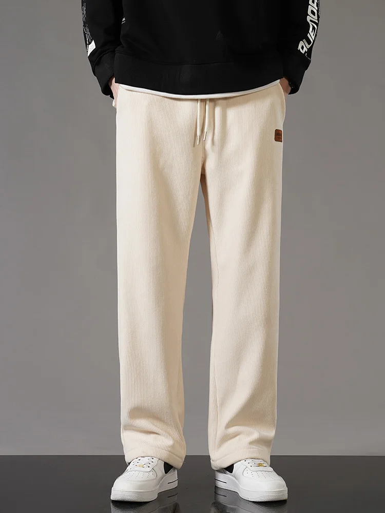 Men's brown corduroy fleece-lined loose fit jogger pants with adjustable drawstring waist