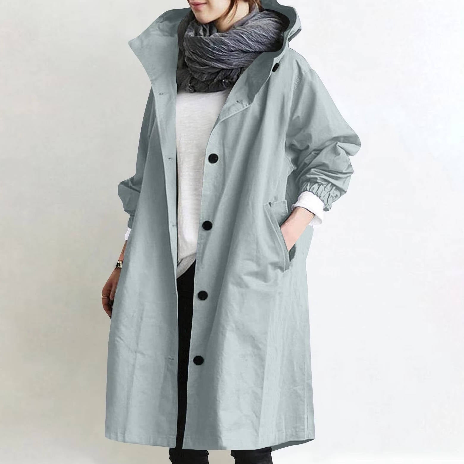 Women's oversized waterproof trench coat in neutral tone, relaxed silhouette with ultra-dry polyester fabric
