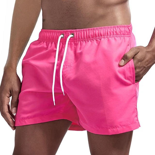 Men's gray quick-dry swim trunks with drawstring waist, comfort fit, and built-in mesh lining