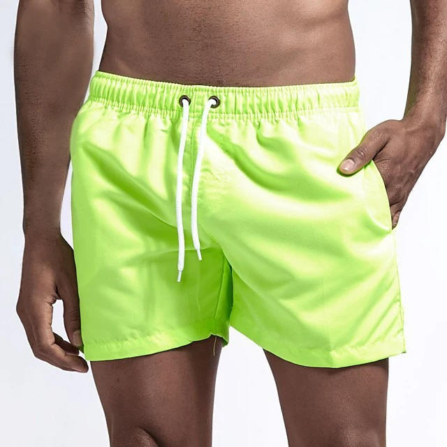 Men's gray quick-dry swim trunks with drawstring waist, comfort fit, and built-in mesh lining