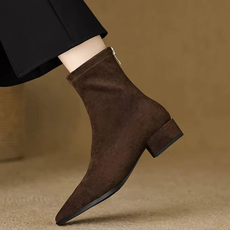 Women's suede ankle boots low heel in neutral tone, slip-on style with soft flexible upper
