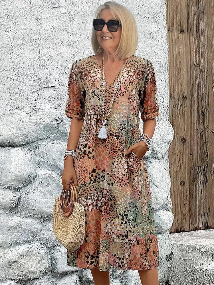 Colorful patterned midi dress with vibrant print, effortless elegant cut, and bold standout design