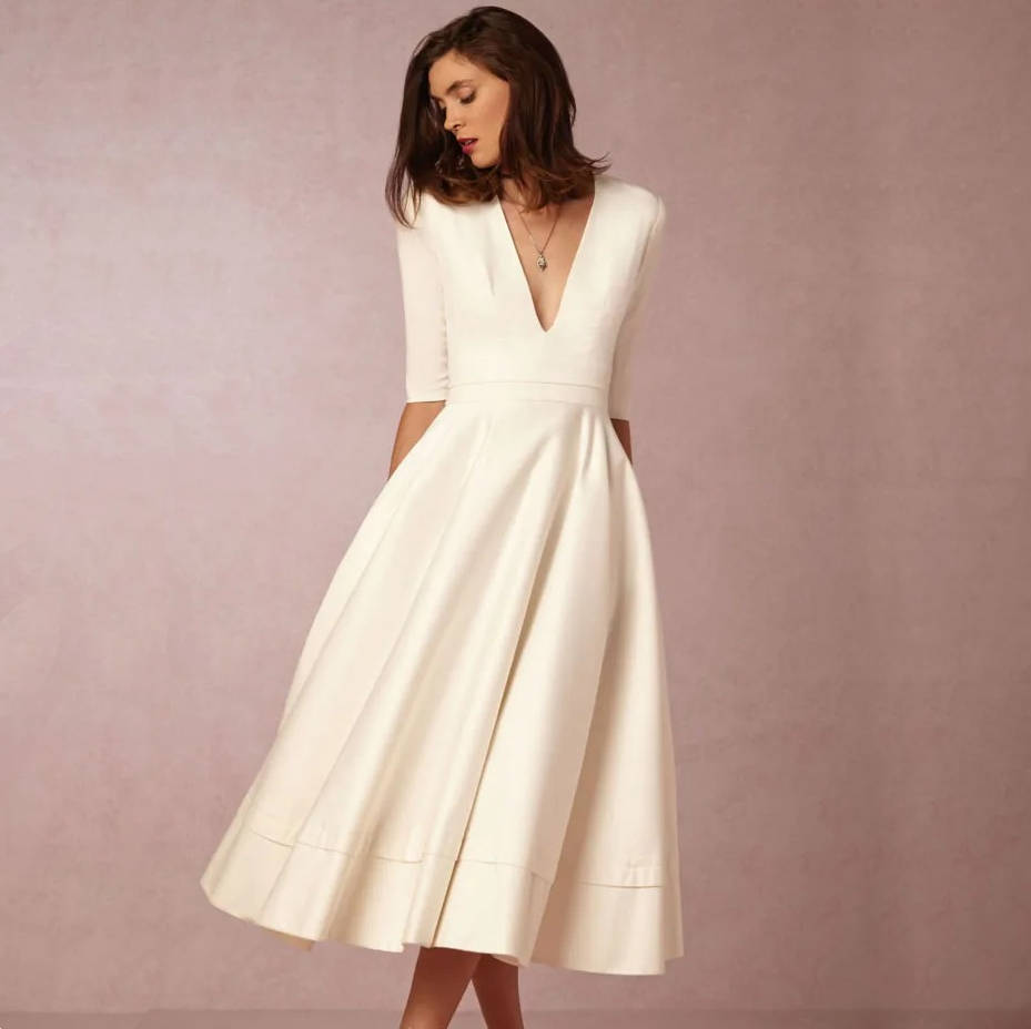 Elegant deep V-neck midi dress in solid color, sleek fitted silhouette for special occasions