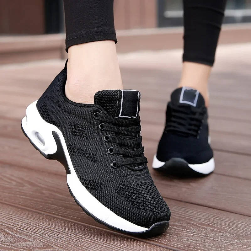 Women's light gray comfort walking shoes with breathable stretch knit upper and cushioned sole