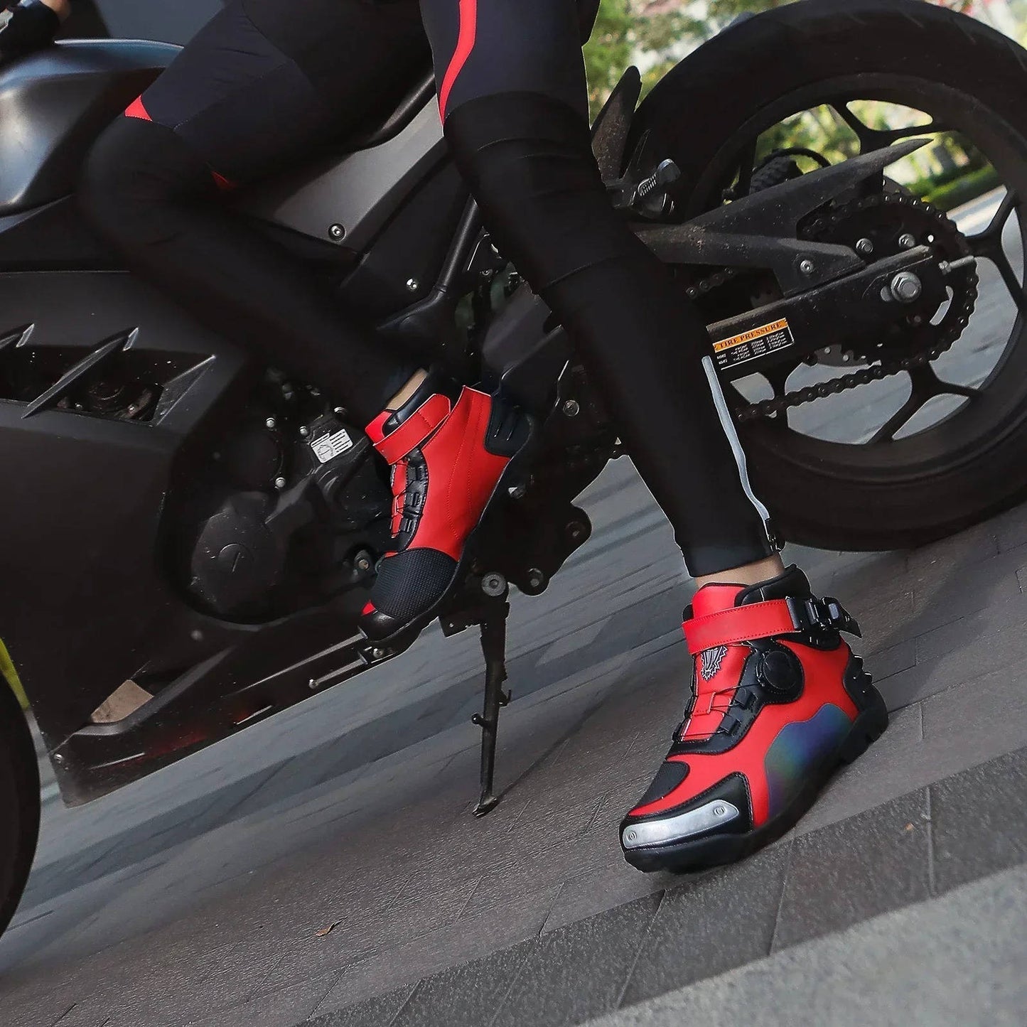 Black motorcycle sneakers with reinforced toe, ankle protection, and casual streetwear style for men and women
