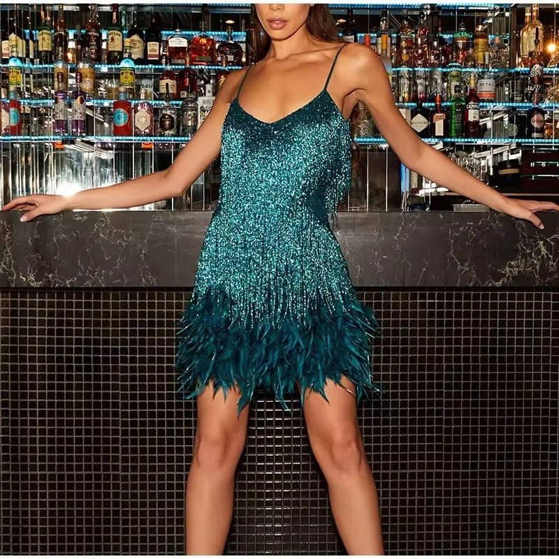 White sleeveless mini cocktail dress with sequin fringe body and dramatic feather hem