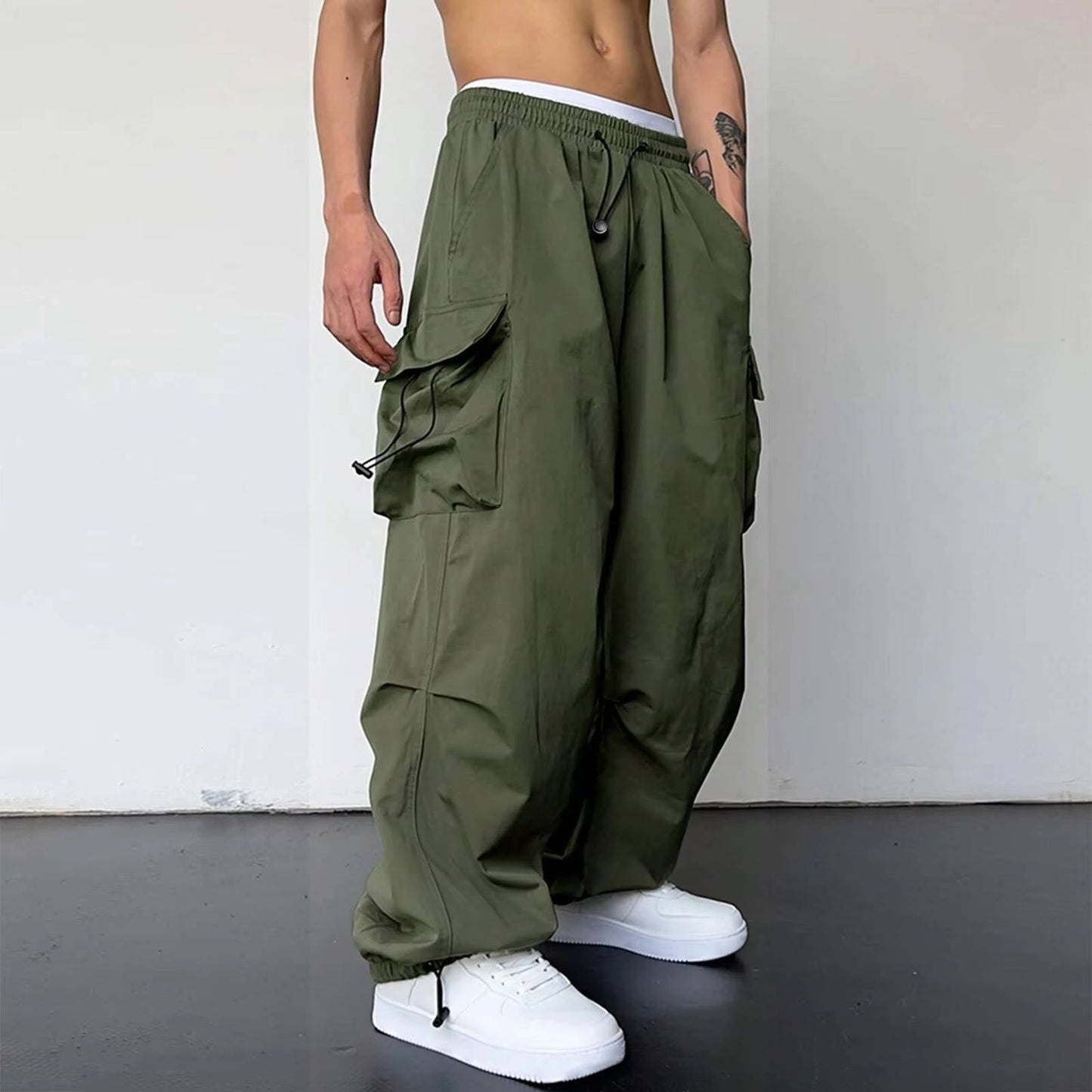 Men's baggy cargo pants wide leg fit large side pockets drawstring waist streetwear style