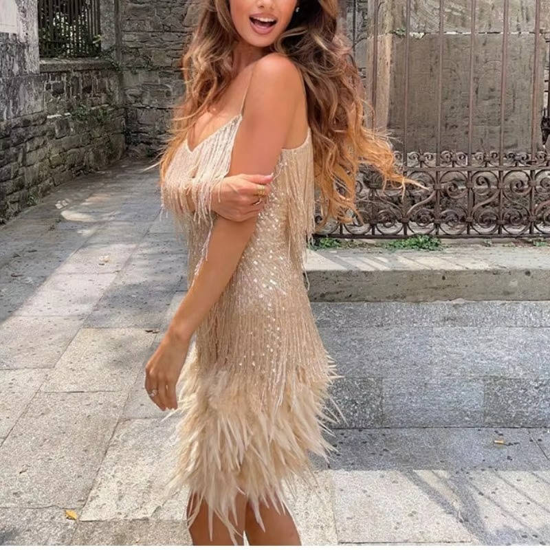White sleeveless mini cocktail dress with sequin fringe body and feather hem detailing