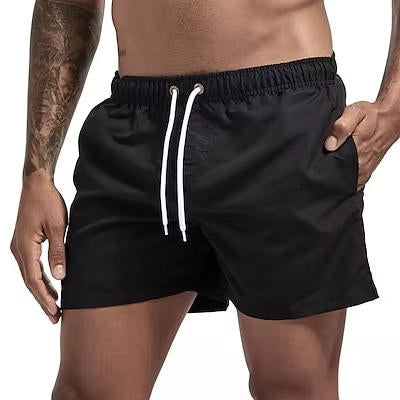 Men's gray quick-dry swim trunks with drawstring waist, comfort fit, and built-in mesh lining