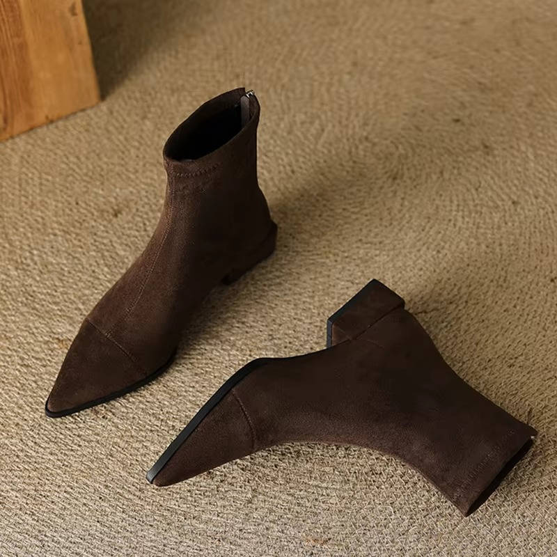 Women's suede ankle boots low heel in neutral tone, slip-on style with soft flexible upper