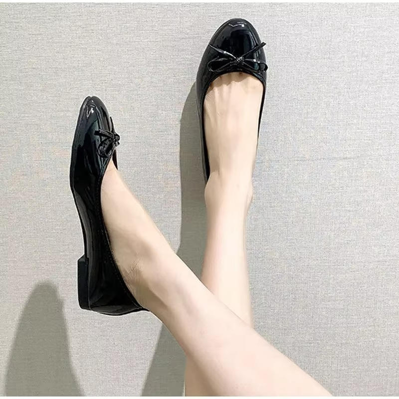 Black leather ballet flats with built-in comfort support, polished office-ready style for all-day comfort