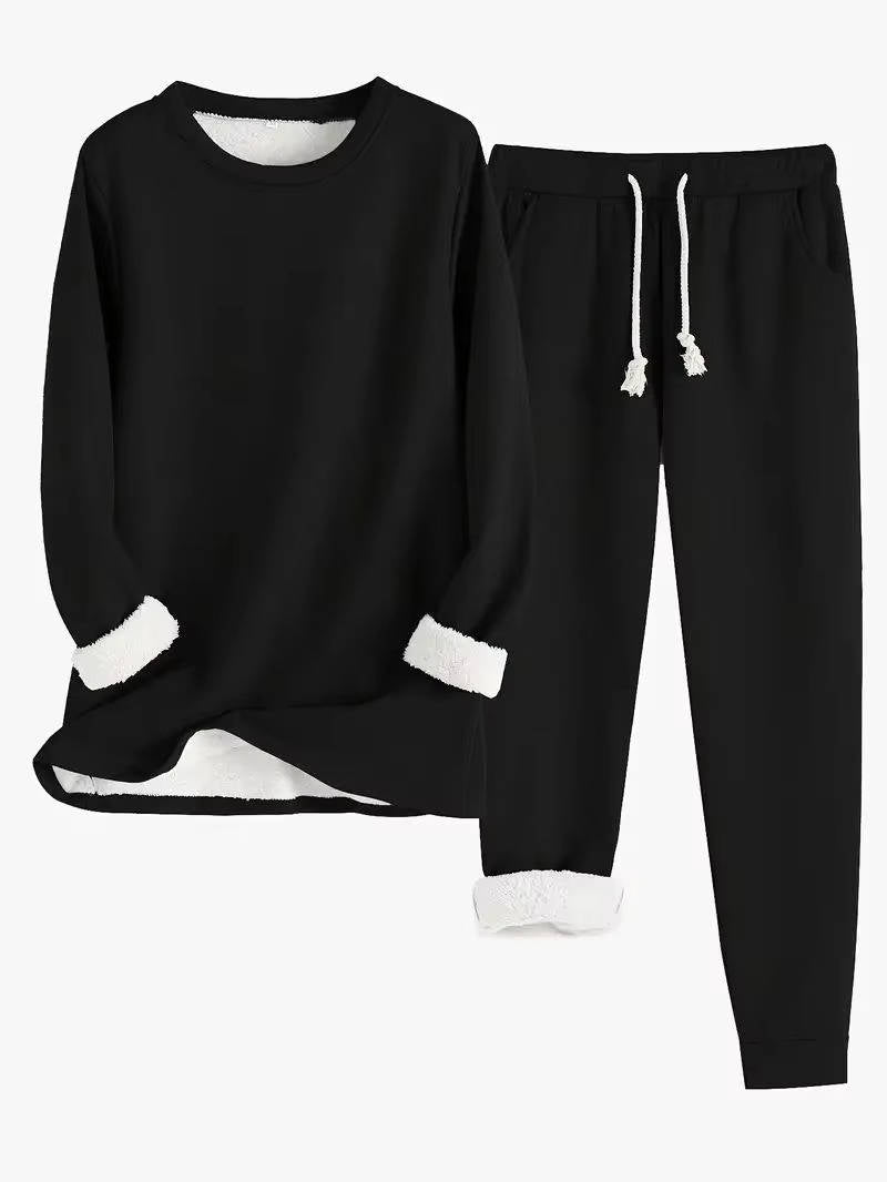 Women's fleece-lined sweatsuit set in neutral tones, relaxed two-piece matching loungewear outfit