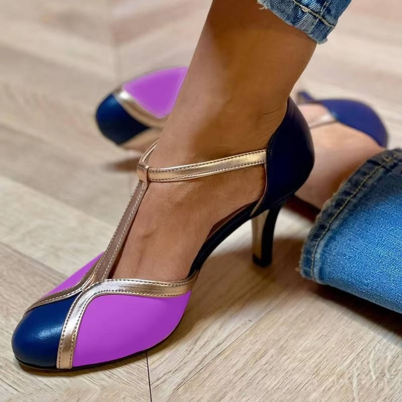 Women's vintage T-strap heels in classic neutral tone, open-vamp silhouette with adjustable back strap