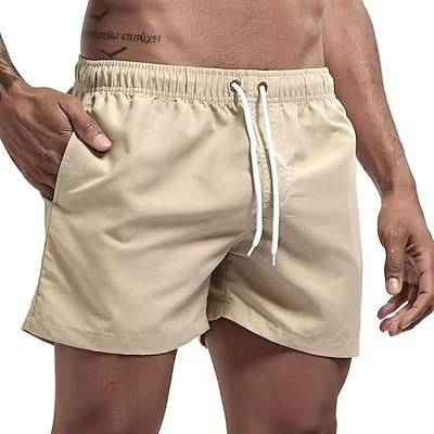 Men's gray quick-dry swim trunks with drawstring waist, comfort fit, and built-in mesh lining