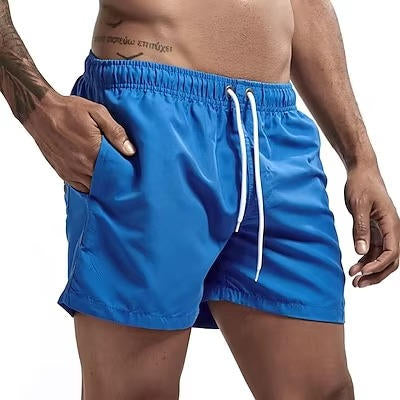 Men's gray quick-dry swim trunks with drawstring waist, comfort fit, and built-in mesh lining