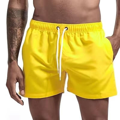 Men's gray quick-dry swim trunks with drawstring waist, comfort fit, and built-in mesh lining