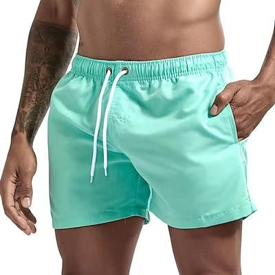 Men's gray quick-dry swim trunks with drawstring waist, comfort fit, and built-in mesh lining