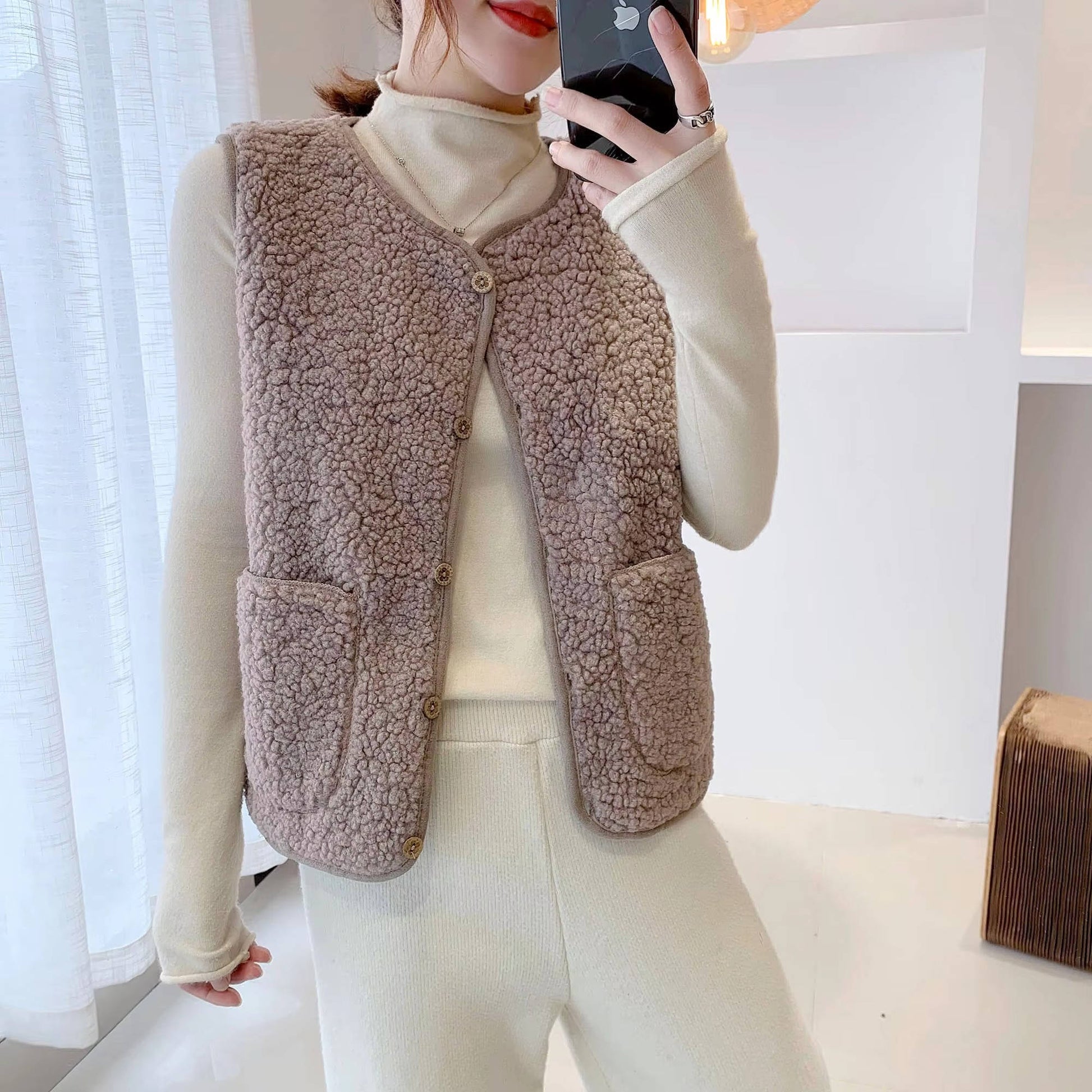 Women's sherpa vest cozy fleece-lined V-neck sleeveless warm layering vest with plush fluffy texture