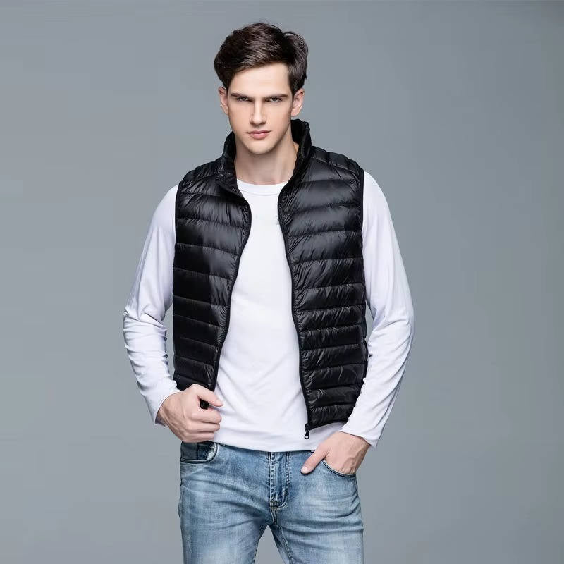 Men's navy lightweight packable down vest, sleeveless travel outerwear with polished slim silhouette
