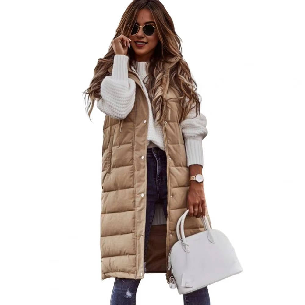 Long hooded sleeveless puffer vest in neutral tone, knee-length cut with quilted insulation for cold days