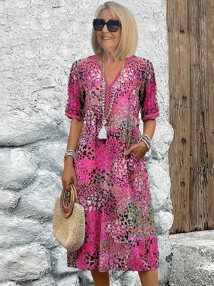 Colorful midi dress with bold eye-catching pattern, relaxed feminine silhouette for brunch or evening events
