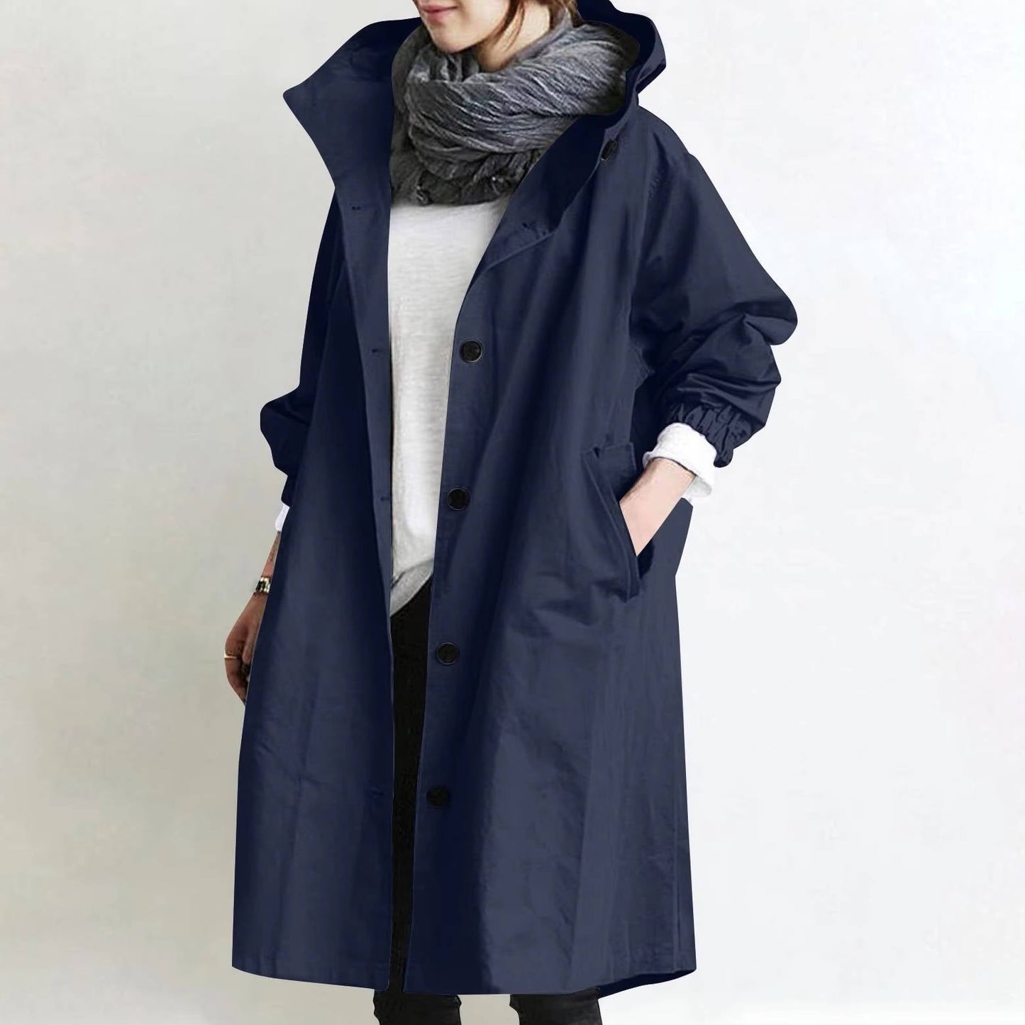Women's oversized waterproof trench coat in neutral tone with relaxed silhouette and ultra-dry polyester fabric