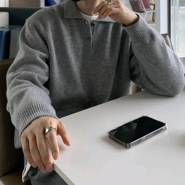 Black men's Korean-style knit sweater with polo collar, long sleeve, soft viscose drape for casual wear