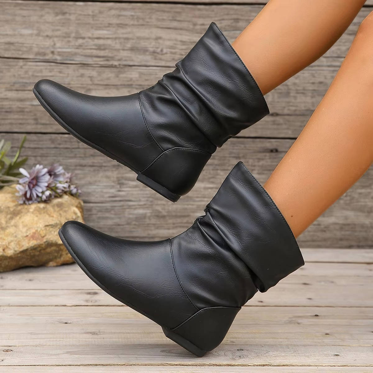 Slouch flat ankle boots in neutral tone with slip-on design and flexible slouchy shaft for everyday wear