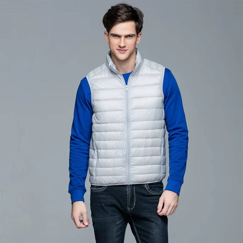 Men's lightweight navy packable down vest, sleek quilted design for travel and winter layering