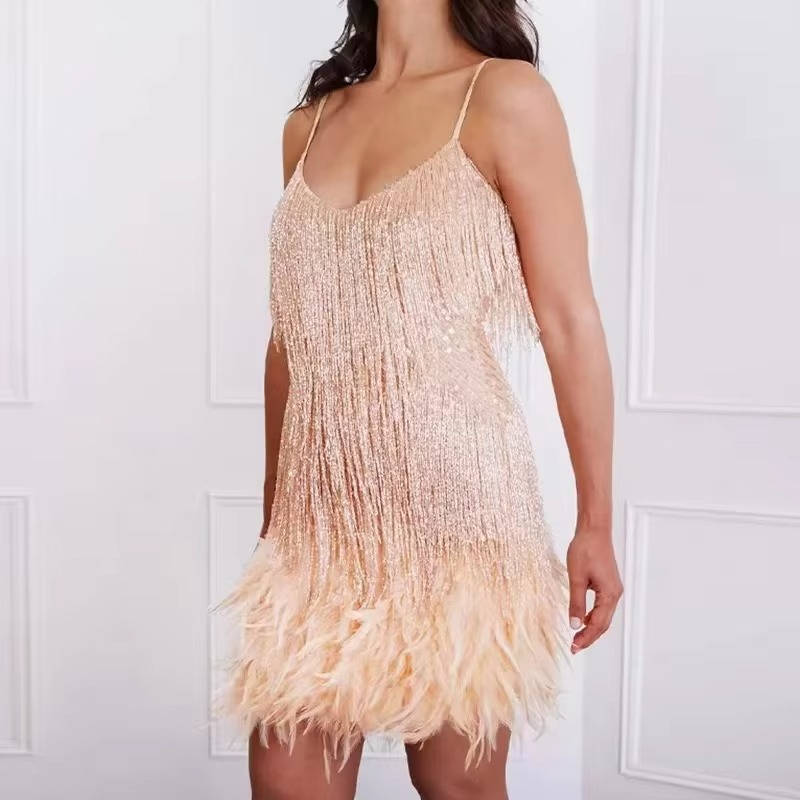 White sleeveless mini cocktail dress with sequin fringe body and dramatic feather hem detailing