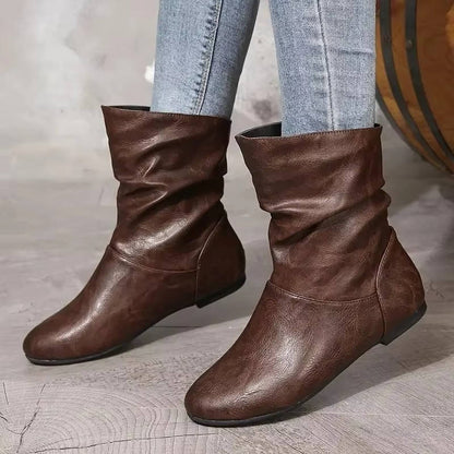 Black slouchy flat ankle boots with slip-on design and flexible shaft for effortless everyday style