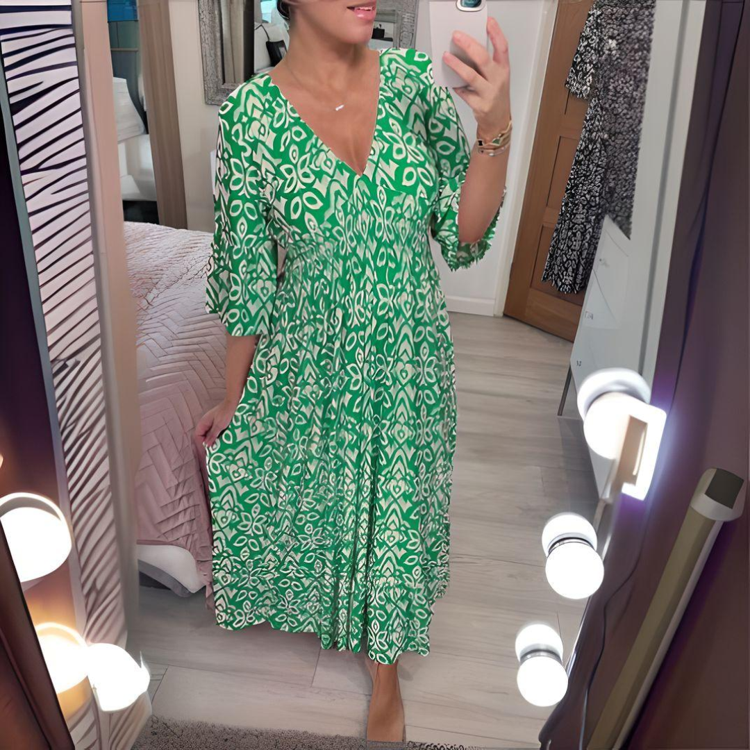 Women's boho flowy printed dress with fitted waist and flowing skirt in artistic print