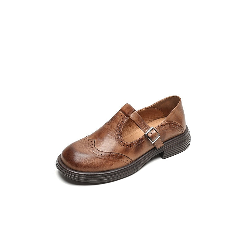 Women's brown leather Mary Jane shoes with T-strap, brogue detailing, and block heel vintage style