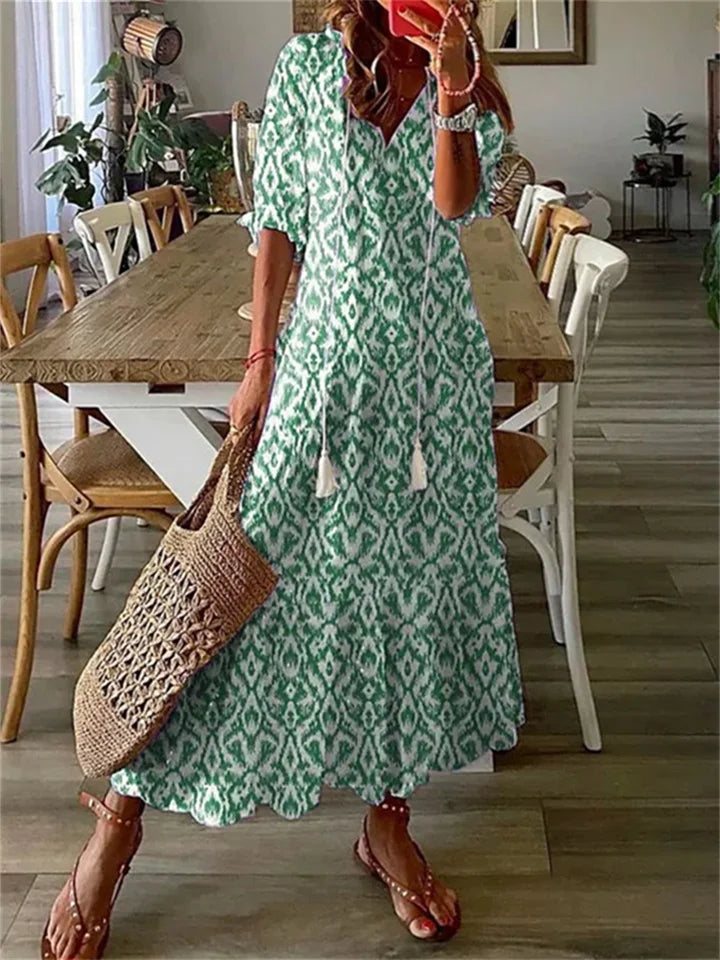 Floral maxi dress with tassel-tie V-neck in romantic boho print, breezy feminine silhouette