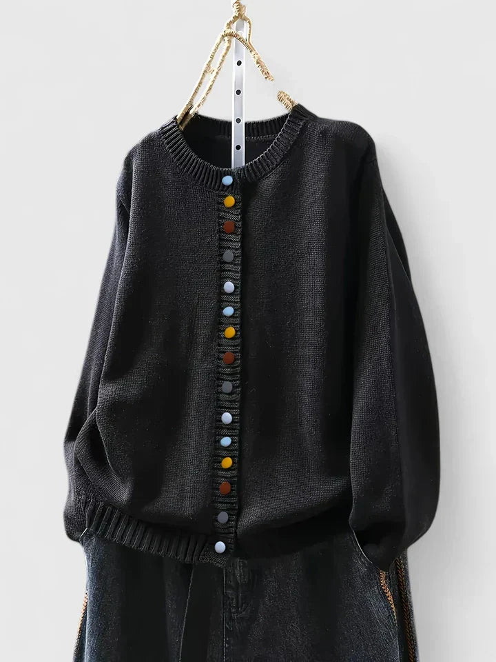 Soft relaxed-fit cardigan in neutral tones with breathable fabric and effortless layering silhouette