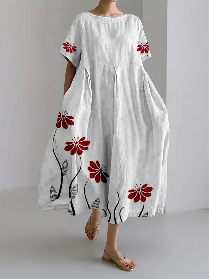 Soft pink floral maxi dress wide relaxed cut with delicate red flower print for effortless feminine style