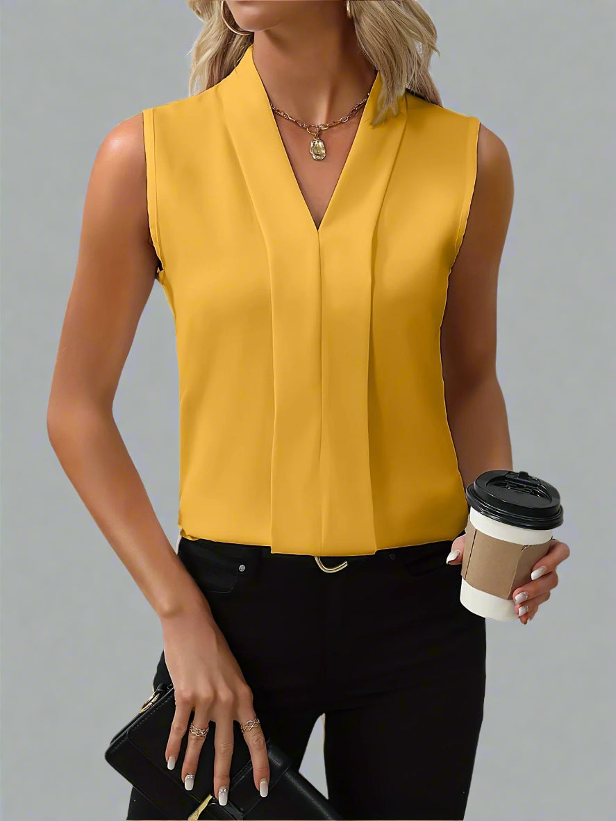 Women's sleeveless V-neck blouse with pleated front detail and stand collar in minimalist style