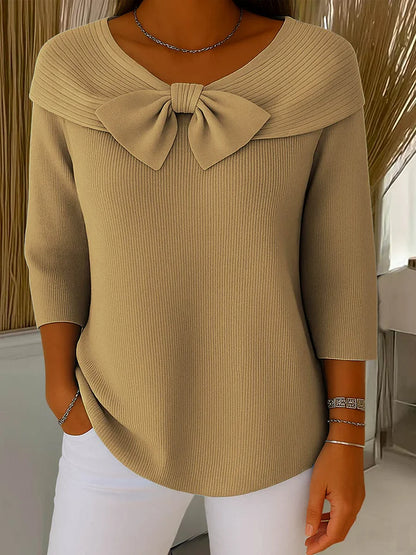 Soft feminine sweater with delicate bow accent detail, elegant chic style in violet hue