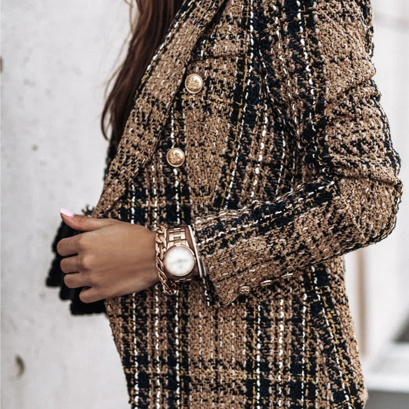Women's tailored tweed blazer in classic pattern with gold buttons and elegant fitted silhouette