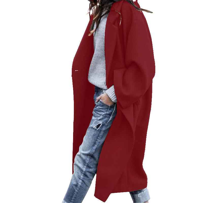 Elegant minimalist long coat with notch lapel, soft polyester, pockets, timeless cold weather style