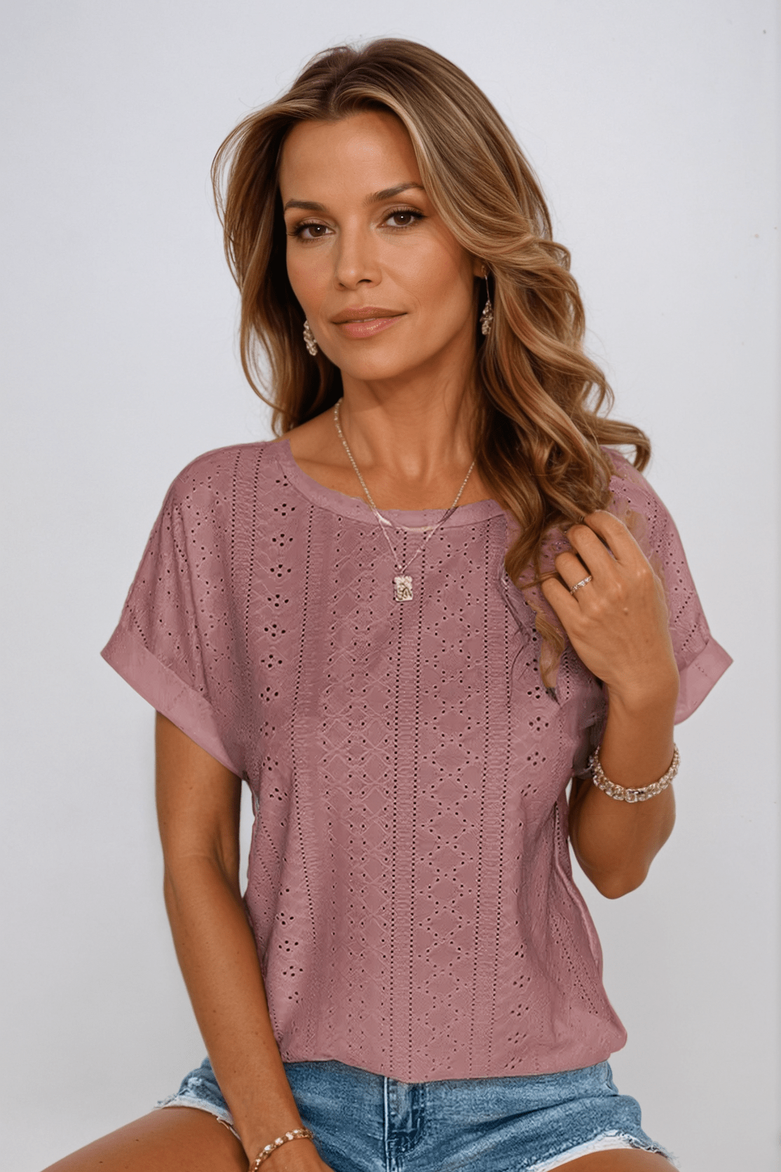 White women's relaxed crew neck short sleeve top with all-over vertical eyelet embroidery detailing