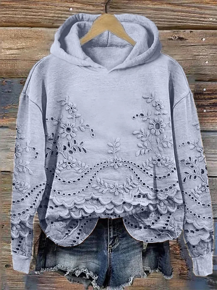 Relaxed floral embroidered hoodie in neutral tones with delicate feminine stitching detail
