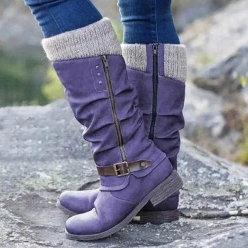 Black knee-high boots with buckle strap accent and soft knit cuff for autumn-winter style