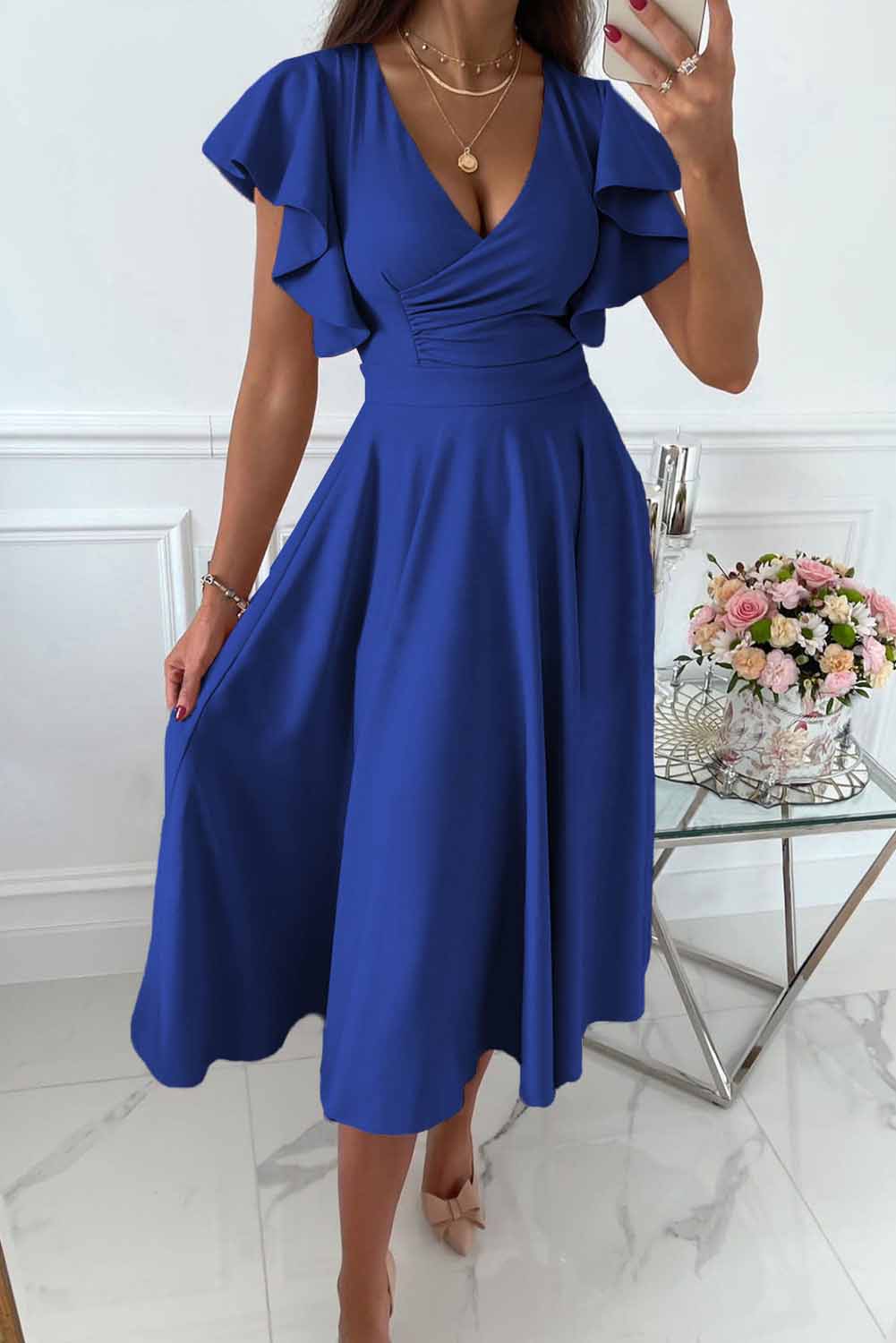 Women's wrap dress with V-neck and ruffle sleeves, elegant feminine silhouette for versatile occasions
