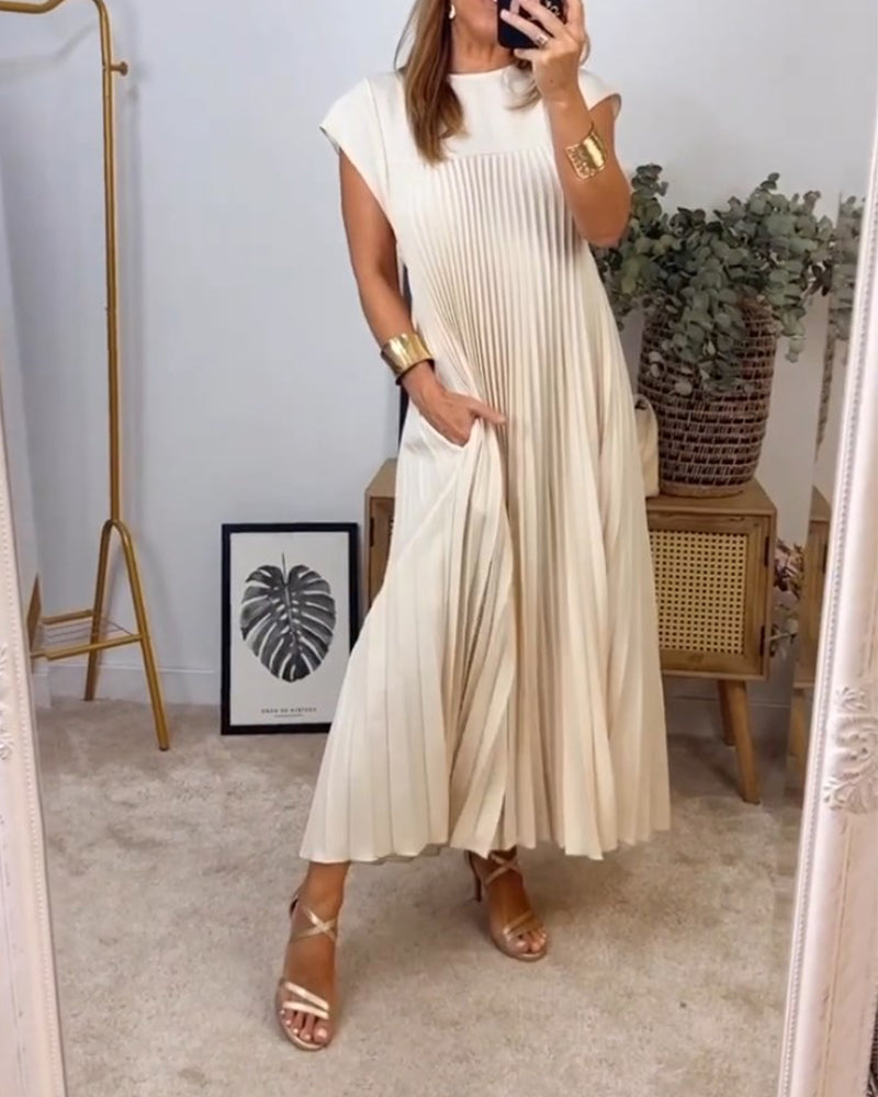 Women's flowy pleated maxi dress in elegant cocktail style with soft elongated silhouette