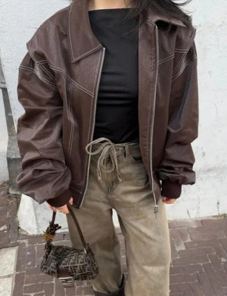 Women's black oversized faux leather motorcycle jacket with zipper closure and relaxed comfort fit