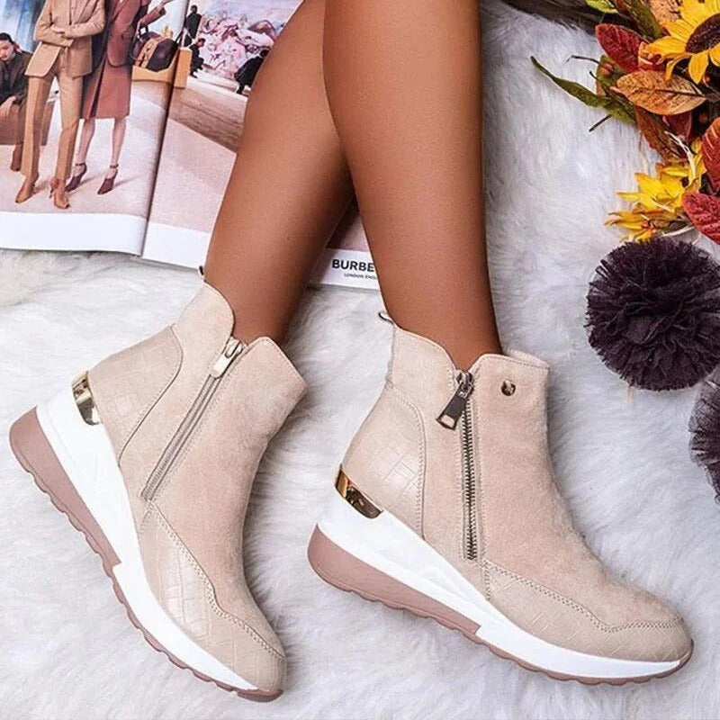 Black zip-up ankle boots with sleek silhouette and winter insulation for cold-weather style